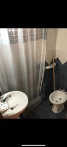 a bathroom with a sink and a toilet at Departamentos Li-Del in Monte Hermoso