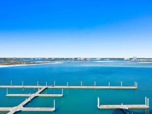 a dock in the middle of a body of water at Caribe The Resort #C702 in Perdido Key