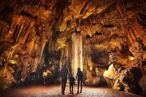 a group of people walking through a cave at Luray Caverns Motels in Luray