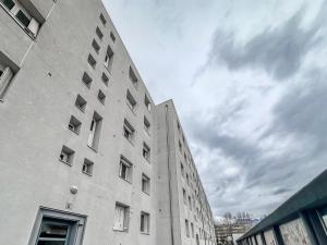a tall building with windows on the side of it at Le Michels - Gare - CEA - STMicro in Fontaine