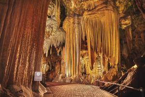 a cave with a bed inside of it at Luray Caverns Motels in Luray