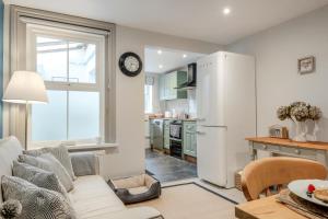 a kitchen and living room with a white refrigerator at 2 Bed in Bembridge oc-p34174 in Bembridge