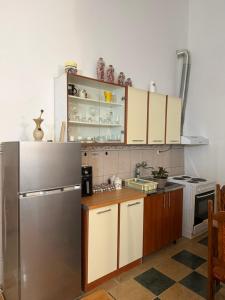 a kitchen with a stainless steel refrigerator at Radovic Apartmani in Herceg-Novi