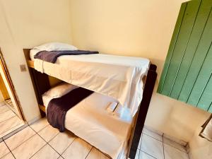 a small room with a bunk bed in it at Casa de Nara in Lençóis