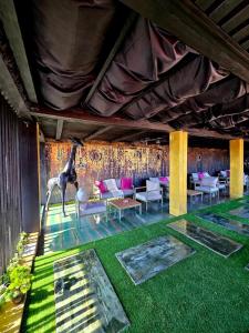 a living room with a giraffe on the wall at Sianisia Adults Only & Private Spa in Haţeg