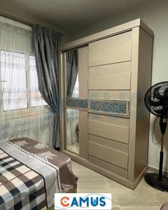 a large dresser in a room with a bed at CAMUS 343, Princess Resort in Hurghada +22 photos