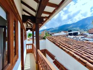 a view from the balcony of a house with a roof at Casa ONCE ONCE in Villa de Leyva