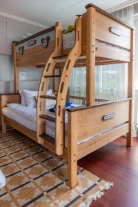 a bunk bed with a ladder in a room at The Delfini Hua Hin in Hua Hin