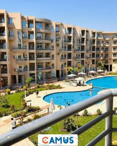 a view of a large apartment complex with a swimming pool at CAMUS 343, Princess Resort in Hurghada