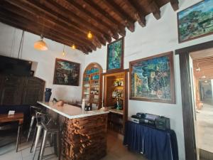 a kitchen with a island in the middle of a room at HOTEL MI SOLAR EJECUTIVO in Uruapan del Progreso