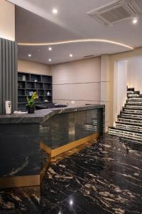 Лобі або стійка реєстрації в Hotel Adler