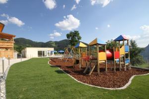 a playground with a colorful slide in a park at Panorama Hof Sereinig in Sankt Oswald