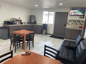 a living room with a couch and a table at Dream Inn in Tonopah