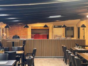 a dining room with tables and chairs in a restaurant at Bonavita Zaton in Zaton