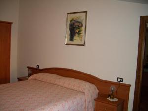 Postel nebo postele na pokoji v ubytování Hotel Ristorante Fiorelli