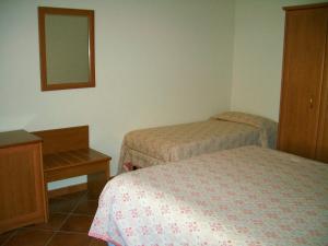 Postel nebo postele na pokoji v ubytování Hotel Ristorante Fiorelli