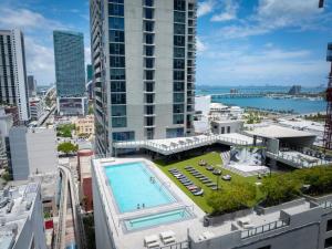 an aerial view of a building with a swimming pool at 29th Floor Balcony Studio Miami Skyline Views in Miami