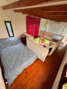 an overhead view of a bedroom in a tiny house at La Tiny in Tigre