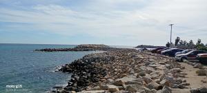 a bunch of cars parked next to the water at Hotelcasacecinn in San José del Cabo