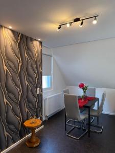 a dining room with a table and chairs at AdiFerienwohnung in Gerolstein