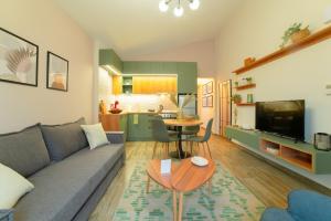 a living room with a couch and a table at Modern house! in Iráklia