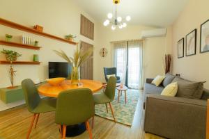 a living room with a table and a couch at Modern house! in Iráklia