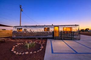 an old train car parked in a parking lot at The Outpost Grand Canyon in Williams