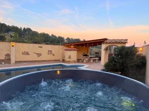 a large tub filled with water on a patio at Casa Marèlia, Costa Daurada Rural in Vilanova de Escornalbou