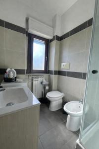 a bathroom with a sink and a toilet and a shower at Il Giardino di Luna in Poggio Nativo