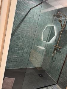 a shower with a glass door in a bathroom at 3 Doni in Rabat +35 photos