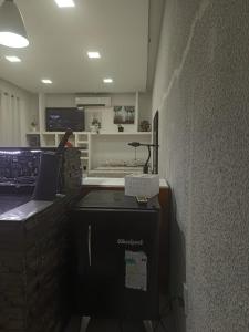 a kitchen with a stove and a wall at Monoambiente Dos Lunas in Resistencia