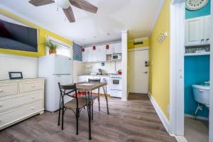 a kitchen with a table and chairs in a room at The Allenhurst in Ocean Grove