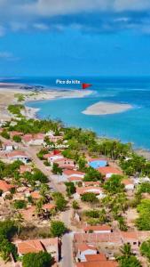 an aerial view of a beach with a red island at Casa Solmar Guriú in Guriú