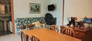 a living room with a couch and a table at Colonne Blu in Ginosa Marina
