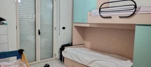 a small room with a bed and a window at Colonne Blu in Ginosa Marina