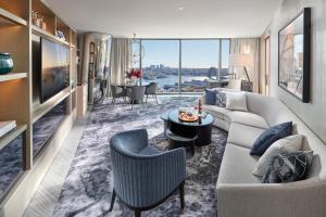 a living room with a couch and a table at Crown Towers Sydney in Sydney
