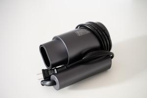 a black flashlight on a white background at Oku Apartment in Tokyo