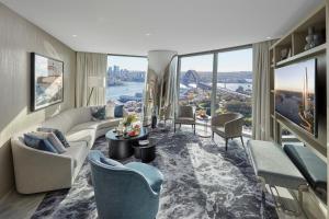 a living room with a view of the city at Crown Towers Sydney in Sydney