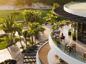 an overhead view of a building with people sitting at tables at The St. Regis Cap Cana Resort in Punta Cana