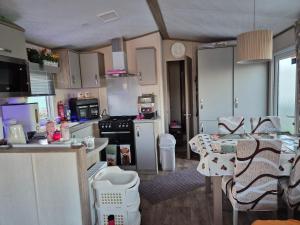 a small kitchen with a table and a counter top at Hills residence in Morecambe