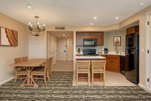 a kitchen and dining room with a table and chairs at WorldMark Angels Camp in Angels Camp