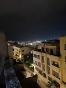 a view of a city at night with buildings at Saada in Tangier