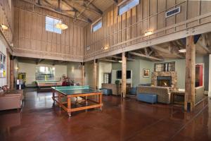 a large room with a ping pong table in it at WorldMark Angels Camp in Angels Camp