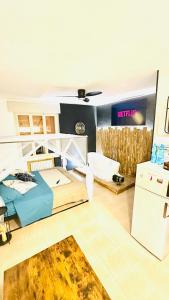 a large room with a bed and a desk at Esclusive Spa Suite in Comacchio