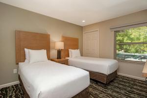 a hotel room with two beds and a window at WorldMark Angels Camp in Angels Camp +68 photos