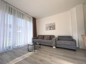 a living room with a couch and a table at Villa Maja in Trebinje