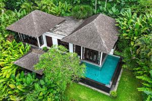 an aerial view of a house with a swimming pool at The Damai in Lovina