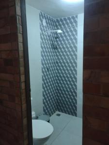 a bathroom with a toilet and a sink at Espaço Nossa Casa, Piscina e churrasqueira Privativas in Paulista +11 photos