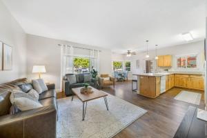 a living room with a couch and a table at Condo with Sauna & Fitness Center, Adjustable Base King Sized Bed in Coeur d'Alene