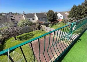 a view from a balcony of a yard at Maison Atypique 5 chambres in Le Mans